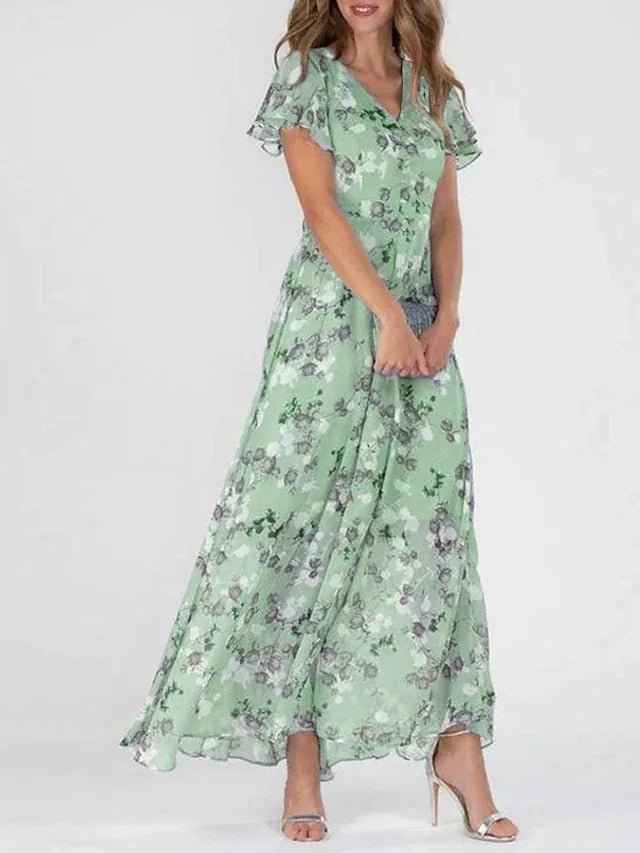 Standaard : Vloeiende Jurk met Elegante Bloemenprint en Overslagdetail in Groen van Pantinoshop