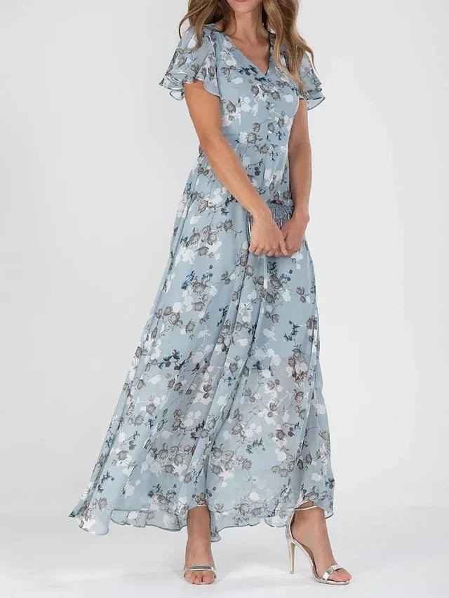 Standaard : Vloeiende Jurk met Elegante Bloemenprint en Overslagdetail in Blauw van Pantinoshop