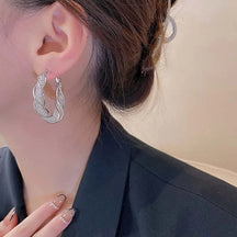 Earrings : Oorbellen Goud - Jewelance Twist - Fashion Twist in Zilver van Pantino