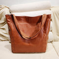 Borsa in Pelle con Chiusura a Bottone e Spazio Extra - Marrone